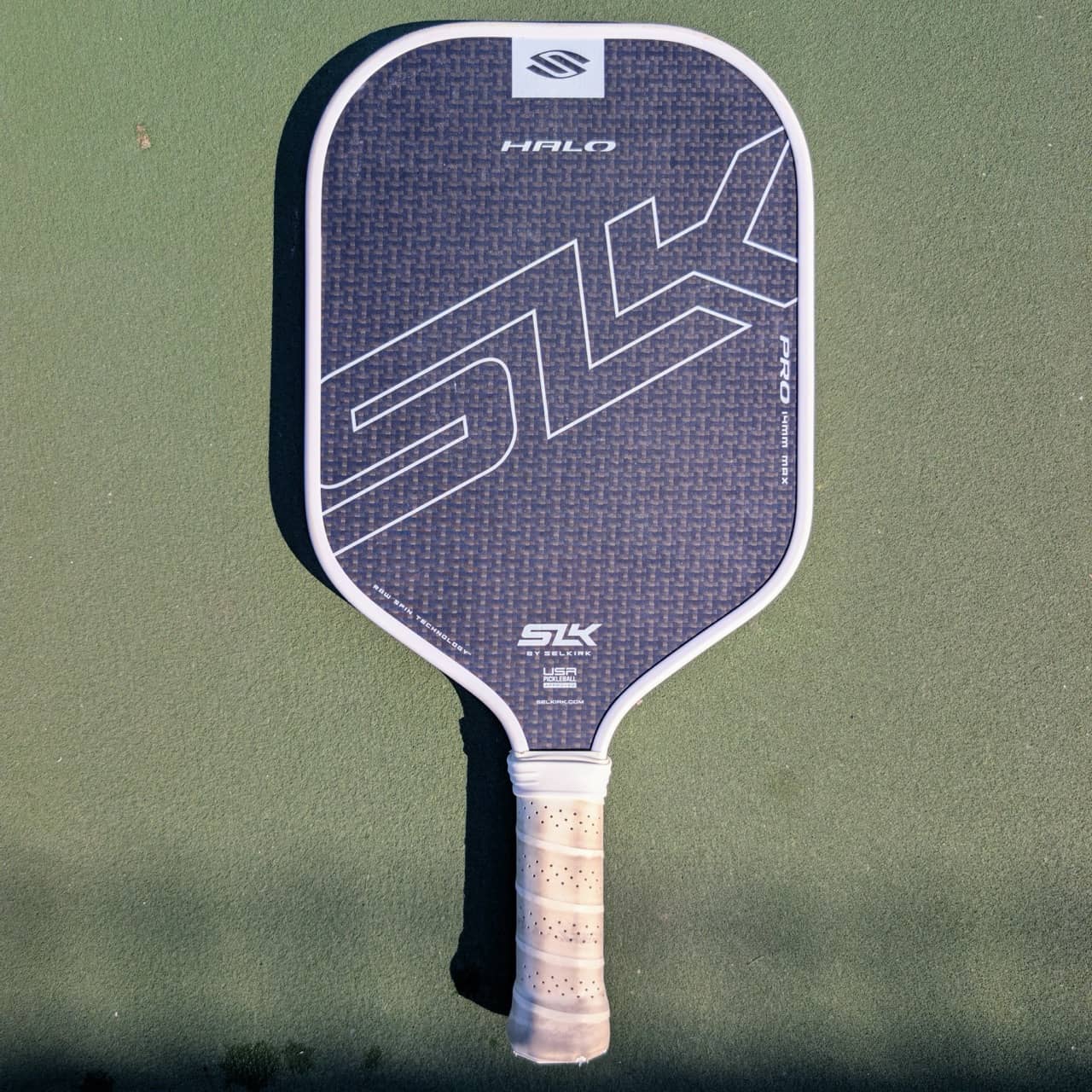 Selkirk SLK Halo Pro pickleball paddle, 14mm, gray, Max shape, on a pickleball court