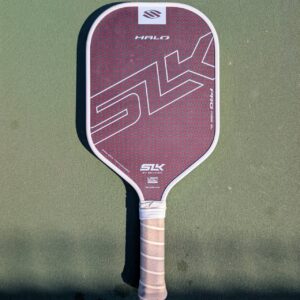 Selkirk SLK Halo Pro pickleball paddle, 14mm, maroon, XL shape, on a pickleball court
